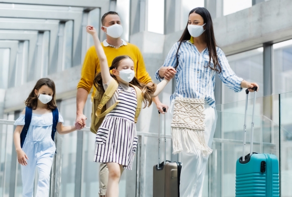 A happy family going on a trip after travel vaccination
