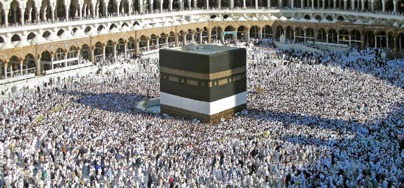 Pilgrims praying around the kaaba in mecca, saudi arabia, during hajj